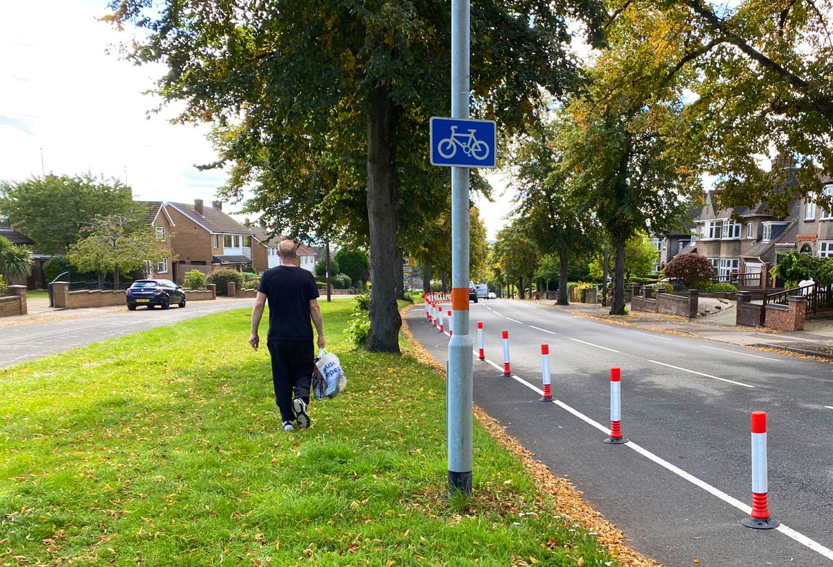 There’s no excuse whatsoever for this. The public realm is enormous here - but it’s chaotic. Footways don’t line up either side of a side road, so pedestrians use the grass, despite all that asphalt!