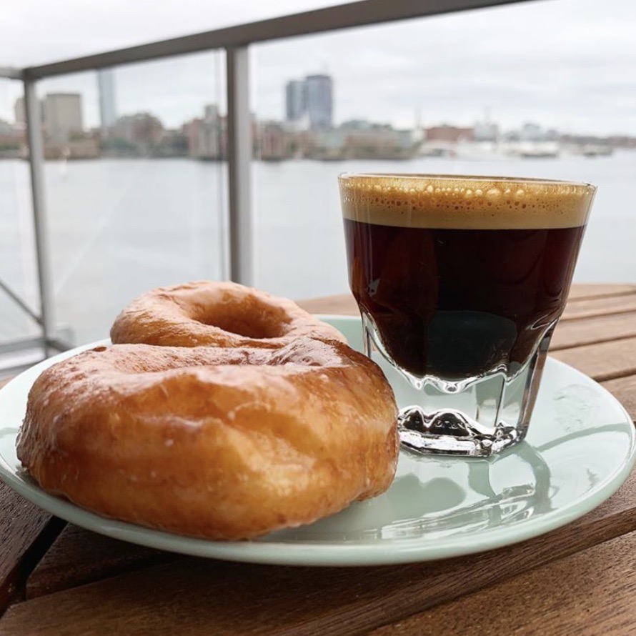 Doughnuts and espresso go together like Clippership Wharf and balconies (we love them). Love this shot from our resident @_tvou on Instagram - check out our available floor plans today for your own scenic breakfast spot: bit.ly/3cNj3qG