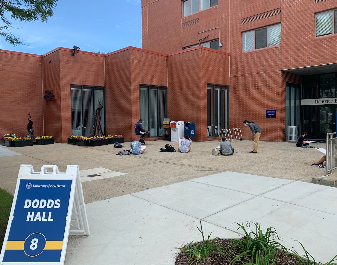 UNewHaven's tweet photo. Prof. Jon Sideriadis (center, standing), coordinator of the #illustration program at #UNewHaven,  recently took students in his “Drawing I” class outside for a fun and safe day of drawing while #PhysicallyDistancing. https://t.co/ku16ZOWGP0