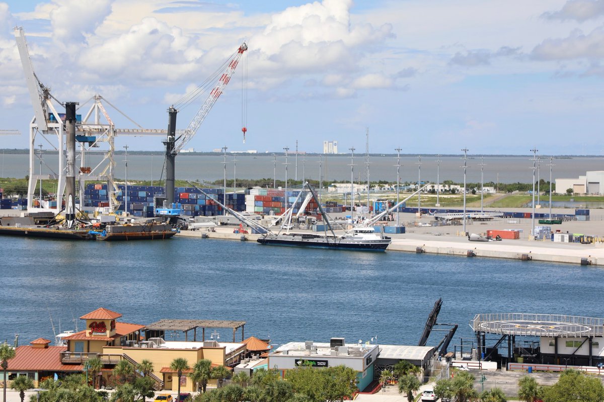 ken_kremer's tweet photo. Elevated wide view of #spacexfleet with 2x flown #Falcon9 w hoisting cap just attached + tech working on legs, #GoMsTree fairing catch ship w/ broken recovered fairing pieces offloaded sitting open on pier and booster transporter awaiting booty behind @PortCanaveral https://t.co/FlZ2UjbUTP