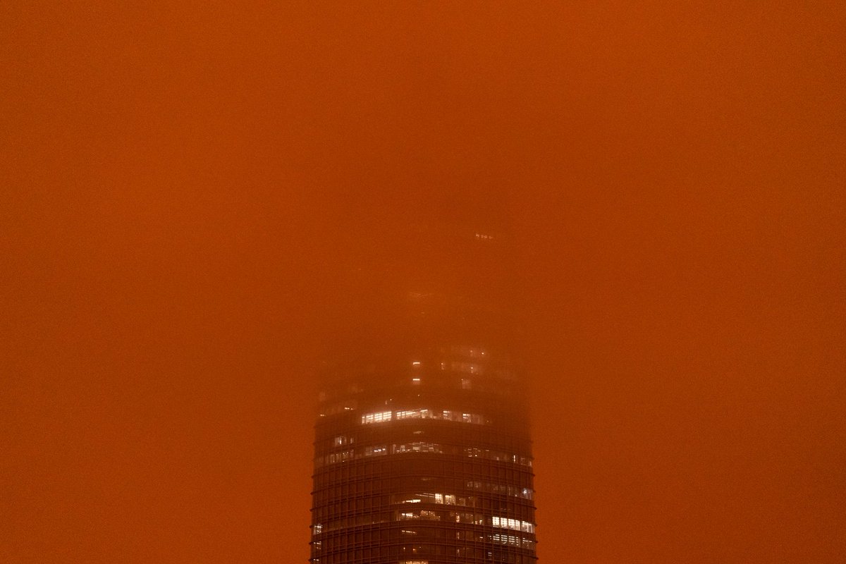 jkimphoto's tweet photo. People across the Bay Area have woken to a surreal scene: smoke from wildland fires across the state have blown in, painting the sky shades of orange. Salesforce Tower is barely visible and the Coca-Cola sign still shines bright as the sun tries to pierce through.

#SanFrancisco https://t.co/mHzdkszxLX