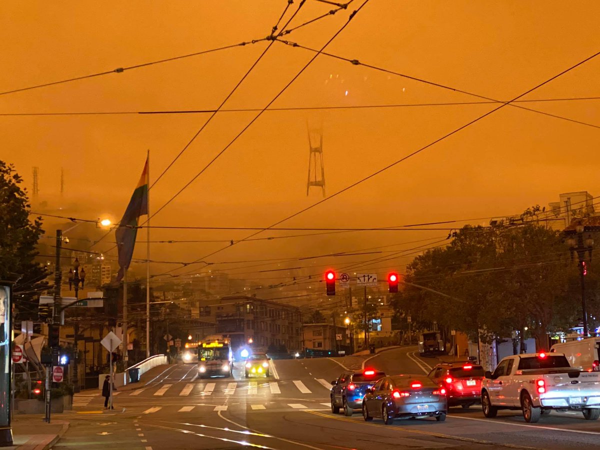 SF_DPH's tweet photo. Today’s sepia skies are due to widespread haze from wildfires burning around us. As the winds weaken above, gravity will take over as primary vertical transport of smoke. Suspended smoke will descend closer to the surface &amp; could lead to darker skies &amp; worsening air quality. https://t.co/7D3JBxEAFL