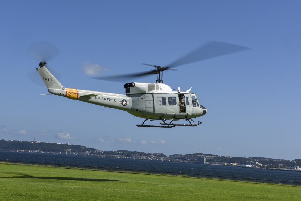 INDOPACOM's tweet image. A UH-1N Iroquois assigned to the @PACAF 459th Airlift Squadron conducts a site survey for an alternate landing zone onboard @CFAY_Japan  #HeloOps #FreeandOpenIndoPacific.