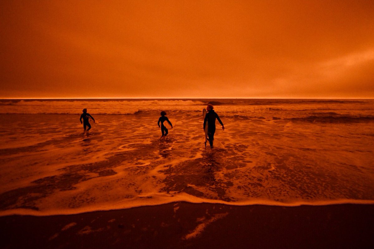 bethlaberge's tweet photo. Surfers at Ocean Beach in San Francisco today around noon under an #orangesky due to smoke from wildfires in Northern California and Oregon. @KQEDnews 

#BayAreaFires #Surfing #OceanBeach https://t.co/NMqM2wNae7