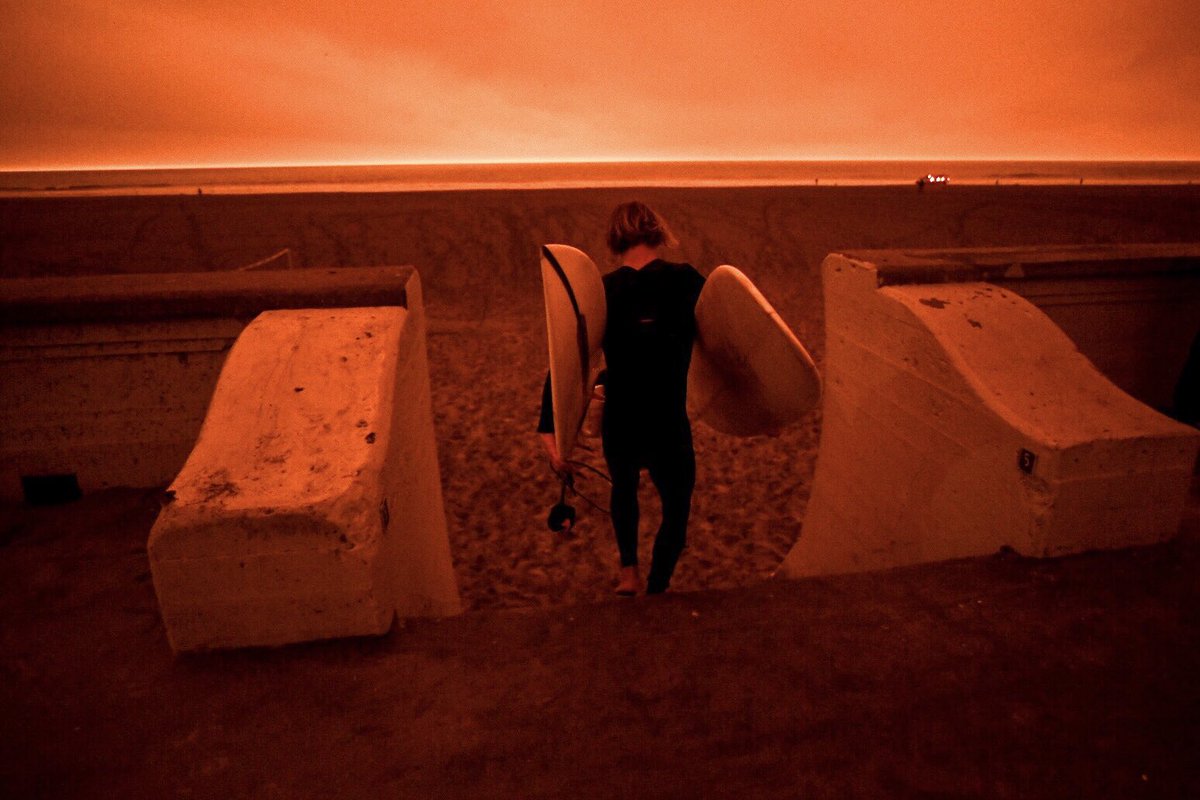 bethlaberge's tweet photo. Surfers at Ocean Beach in San Francisco today around noon under an #orangesky due to smoke from wildfires in Northern California and Oregon. @KQEDnews 

#BayAreaFires #Surfing #OceanBeach https://t.co/NMqM2wNae7