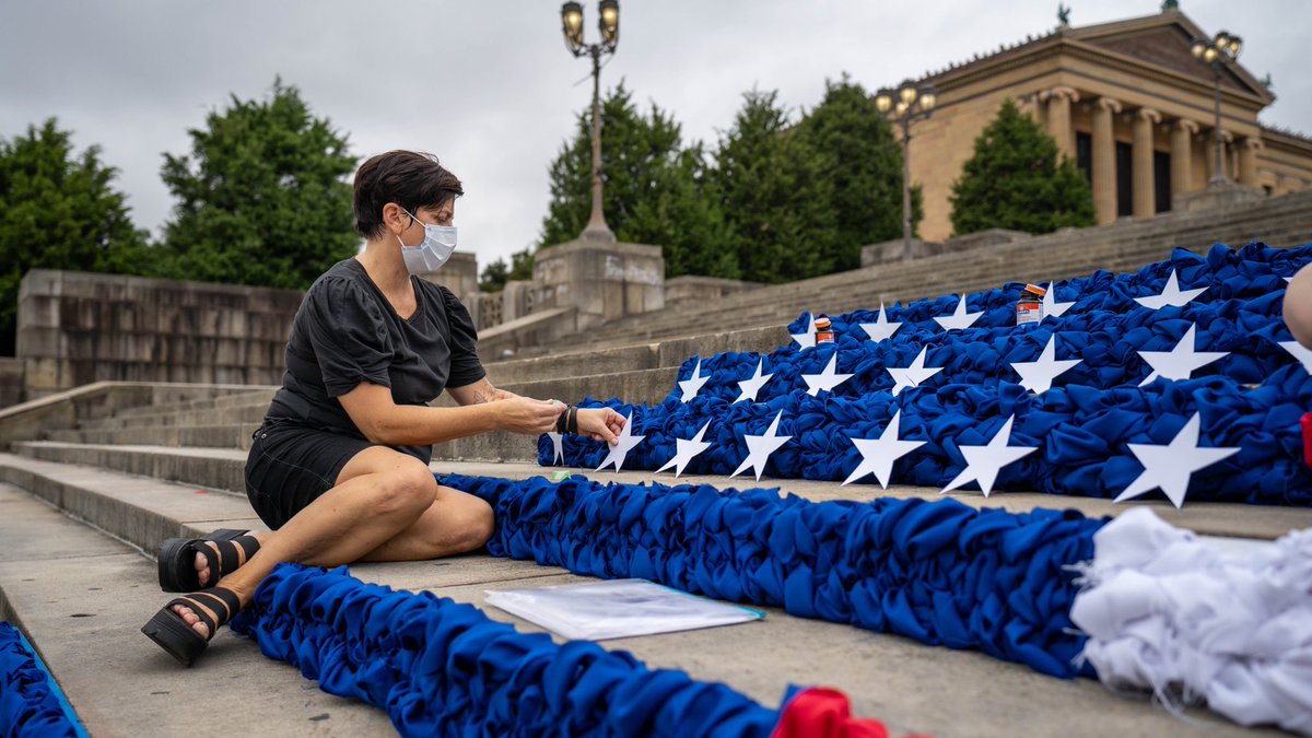 March4Philly's tweet photo. Today we registered voters and participated in an art installation addressing gun violence and poverty in America. @mmhaims_ created the American flag behind us unraveling to spell out “End Gun Violence”. 

#OurPower #VoteForOurLives 
📸: Dylan Eddinger https://t.co/ln4uHoEkyR