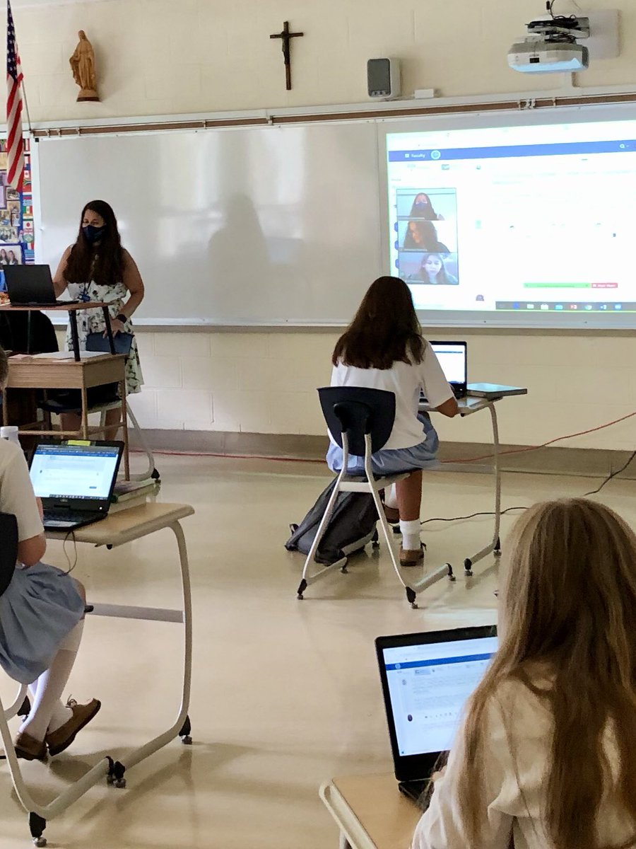 AHA_Principal's tweet photo. Students at home being projected on whiteboard to interact with their classmates in the classroom. #blendedlearning #engagedstudents #angelstrong https://t.co/64uhiTN350