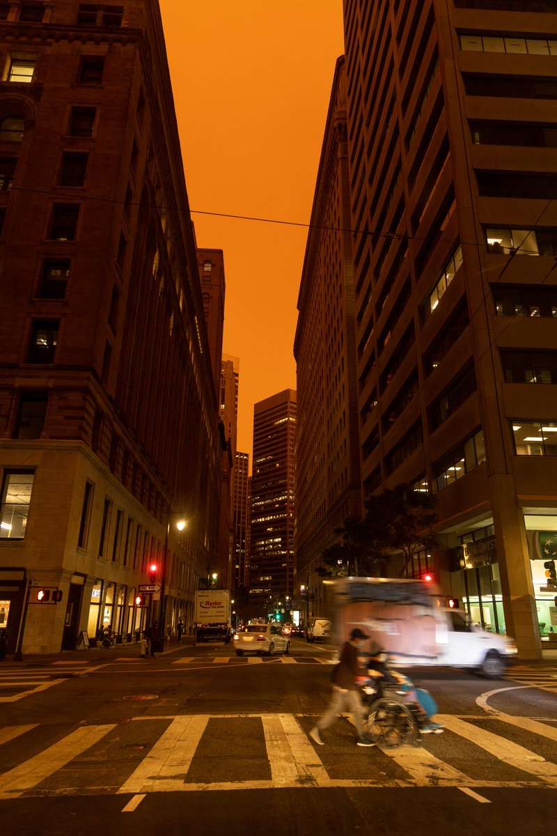 jbuphotos's tweet photo. Orange smoky skies blanket Downtown SF during the midday hours on Wednesday, Sep. 9. Ash fall has started to come down in parts of the Bay Area and is expected to continue in the coming day. (Jun Ueda/GGX News) #CAfire #AirQuality #SanFrancisco #BayArea #CZULightningComplex https://t.co/pL3bpJbteS