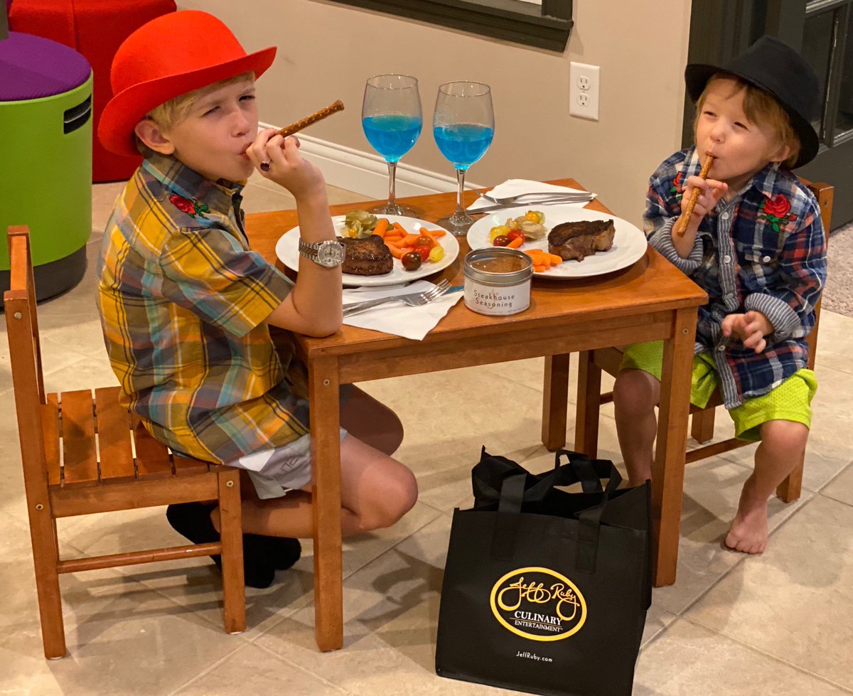 cincy12thman's tweet photo. Carter + Collin love celebrating life with steak night and pretending to be Jeff Ruby. It’s either this or Lunchables. #JeffRubyBag https://t.co/6hv63IIzGl