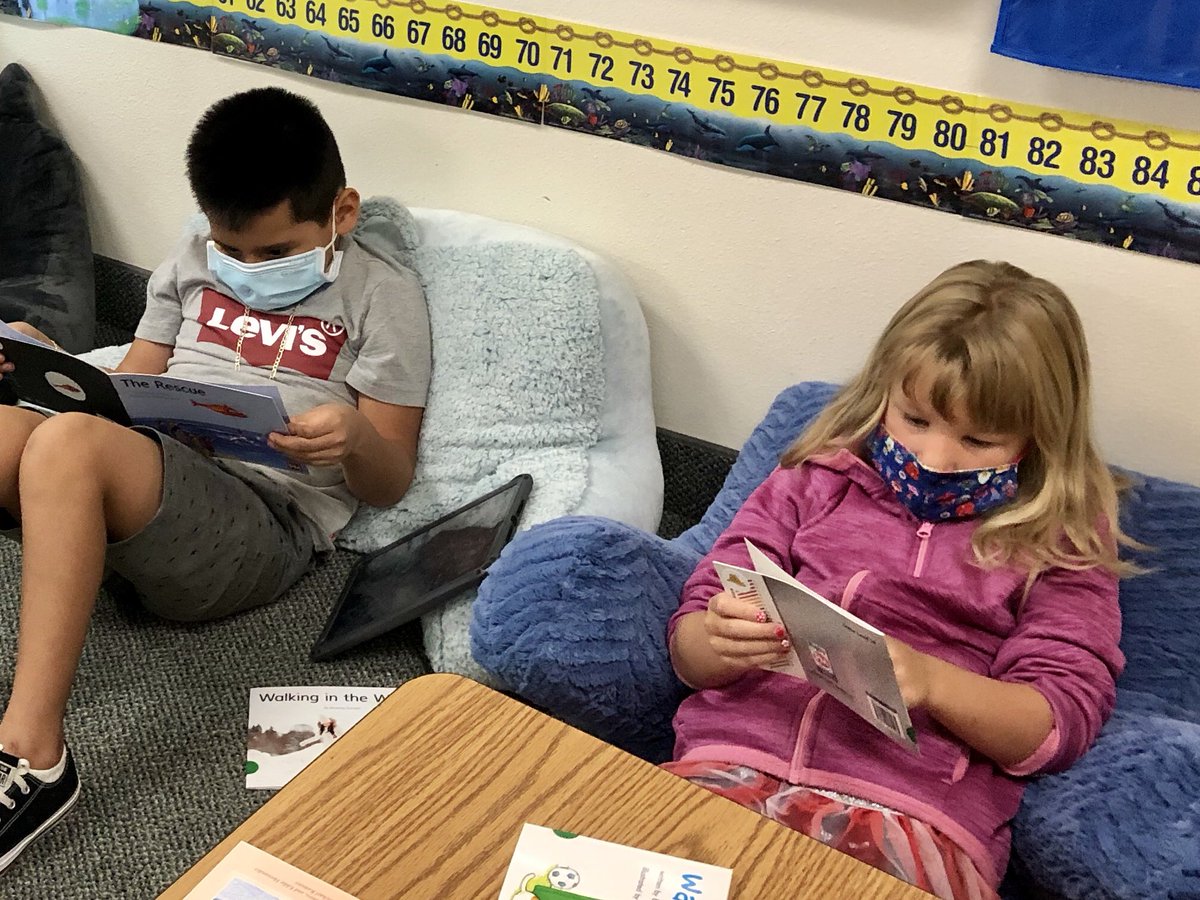 ImpocoJulie's tweet photo. The first 2 days of school teaching 1st grade face-to-face has been a success!  I love seeing the kiddos already so engaged in reading 😷📖 
#ThompsonIsExcellence https://t.co/2jLKGwsigb
