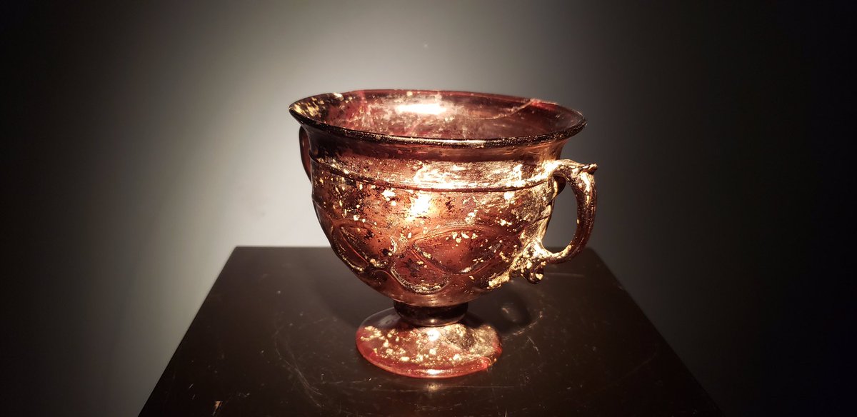 EpsilonArtShare's tweet photo. This beautiful glass #skyphos was crafted between 100 BC and 100 AD in the #Hellenistic period. Its striking, deep color and enduring translucency are unusual qualities, making it a rare piece. You can find it on the #EpsilonArtShare app now! Link in bio.😍 #ancientgreece https://t.co/tMFvFoJQVD