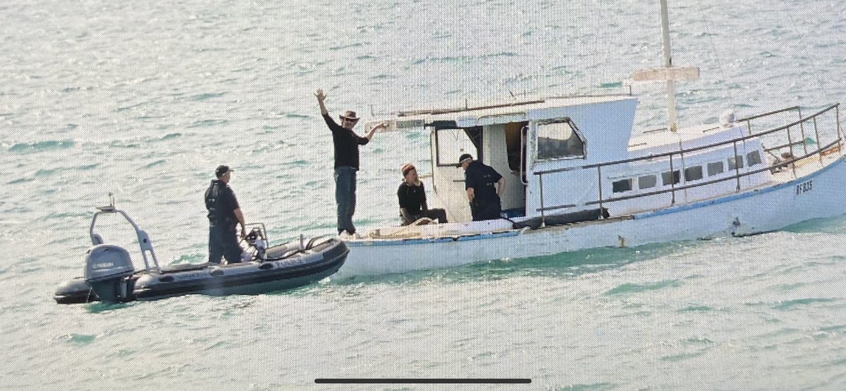 A cheerful Derek Robinson, 48, waves to onlookers at Granite Island. He and Tony Higgins, 57, were towed in their boat from Salt Creek to Victor Harbor after vanishing at sea for four days <a href="/theTiser/">The Advertiser</a>