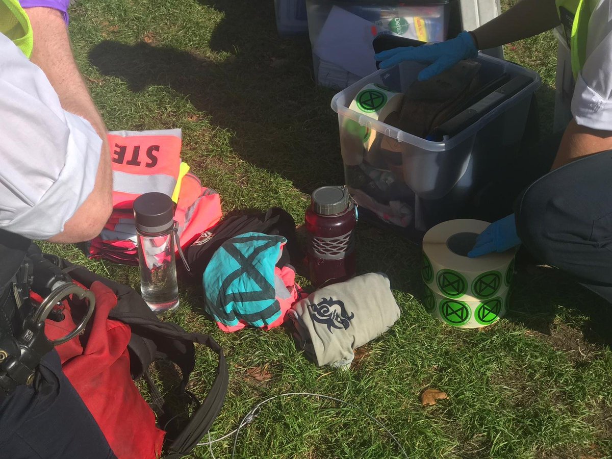 XRebellionUK's tweet image. Welcome to @pritipatel dystopian authoritarian police state, where stewards are arrested setting up the information stall that has been in Parliament Square all week. A few flyers = crime? 

Who are the real criminals? Those who protect the powerful or who #TellTheTruth