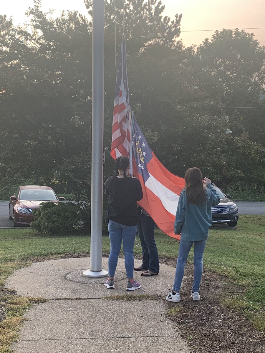 NAO_Elementary's tweet photo. Our 5th graders help raise the the flags for our school each morning. I love this display of citizenship! #NES2020 https://t.co/laZxbcIMUB