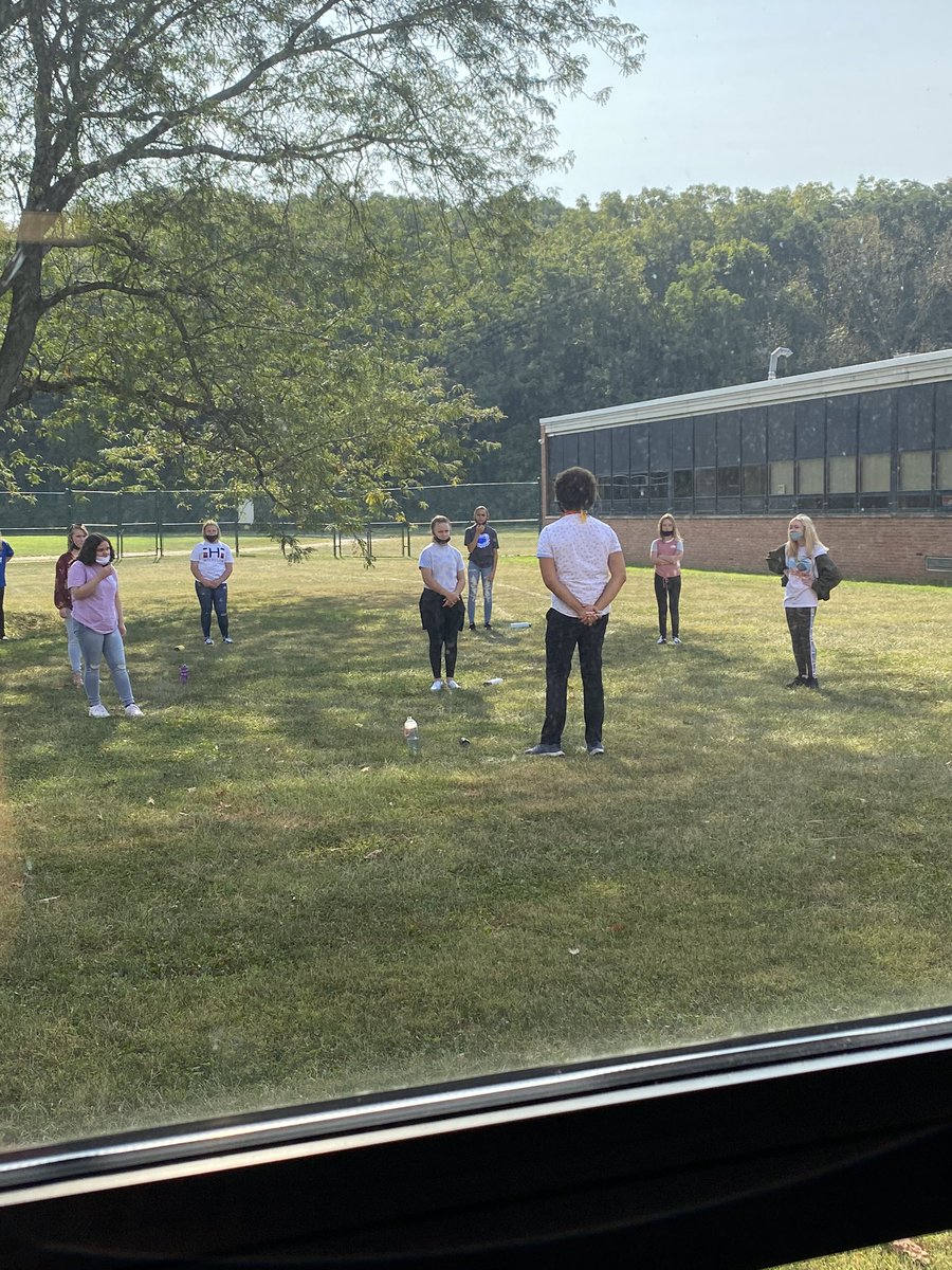 A quick run to the teacher workroom provided me the with opportunity to catch this awesome view! @mrbakerhcsd seizing this beautiful day to teach his Choir students outside. 😊 #YeahImAGriffin