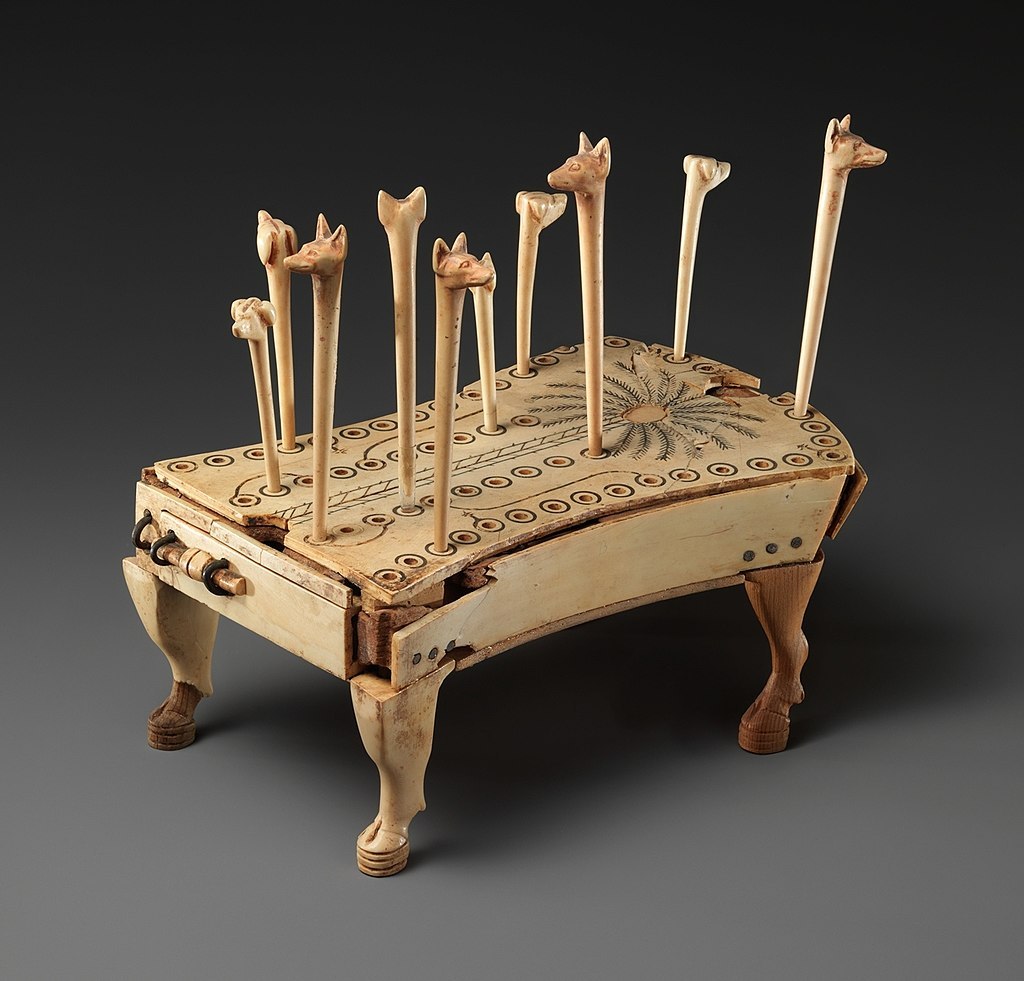 Board and pieces for the game of Hounds and Jackals, made of ivory. Ancient Egypt, 13th dynasty (ca. 1803-1649 BC). Other sets for this game have been found all across Egypt and Mesopotamia.