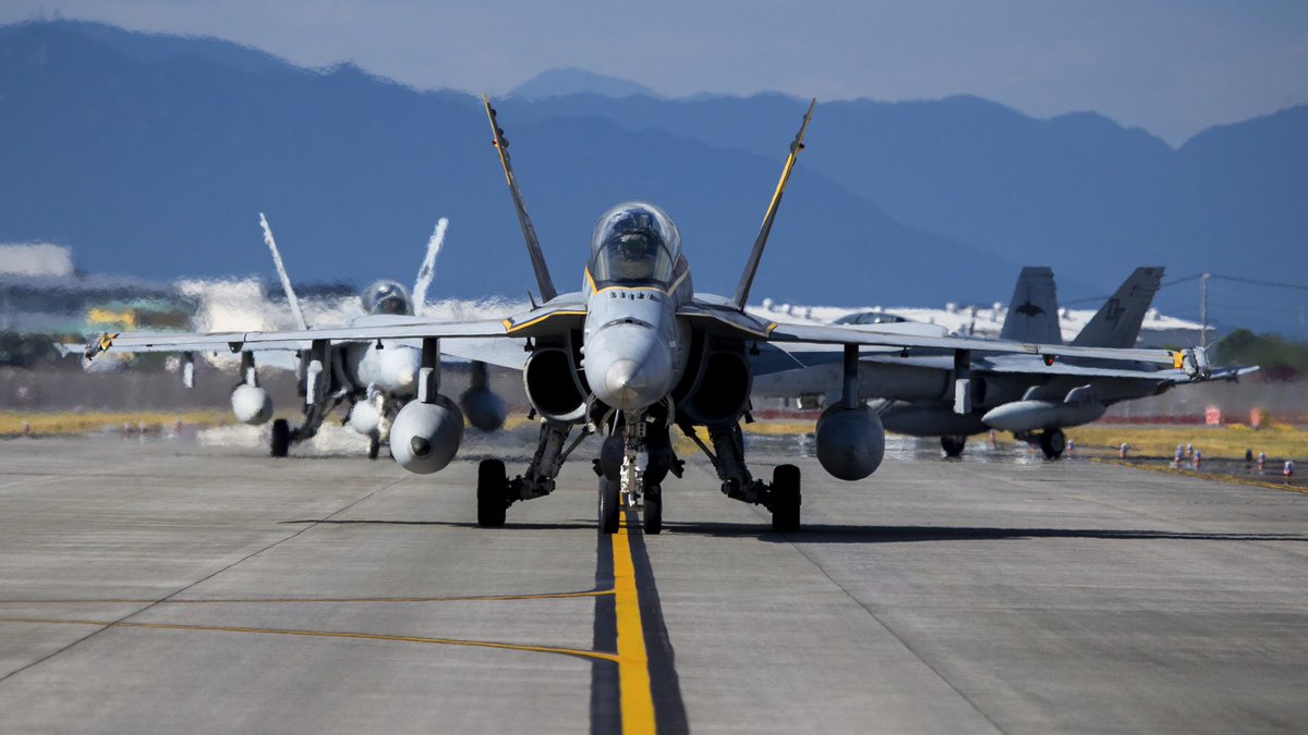 1stMAW_Marines's tweet photo. U.S. Marine Corps F/A-18D Hornets with Marine All-Weather Fighter Attack Squadron (VMFA-AW) 242 taxi the runway at Marine Corps Air Station Iwakuni, Japan, Aug. 26, 2020. The F/A-18D Hornet is a multirole aircraft capable of fleet air defense and force projection. https://t.co/lPndizWxmV