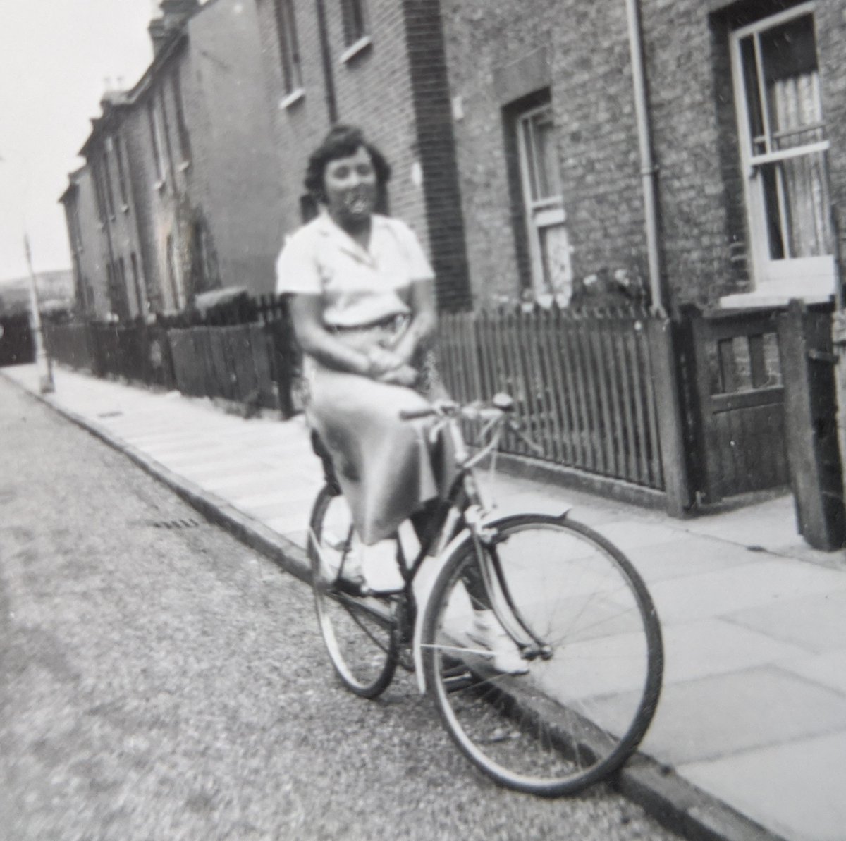 This is my mum, Rose Mortleman, as a teenager in about 1945 outside the 2-up, 2-down terraced house in Twickenham where she grew up with her mum, dad, elderly gran and several pets. It looks like a bubblegum bubble has burst on her face, but it's just foxing on the old photo.