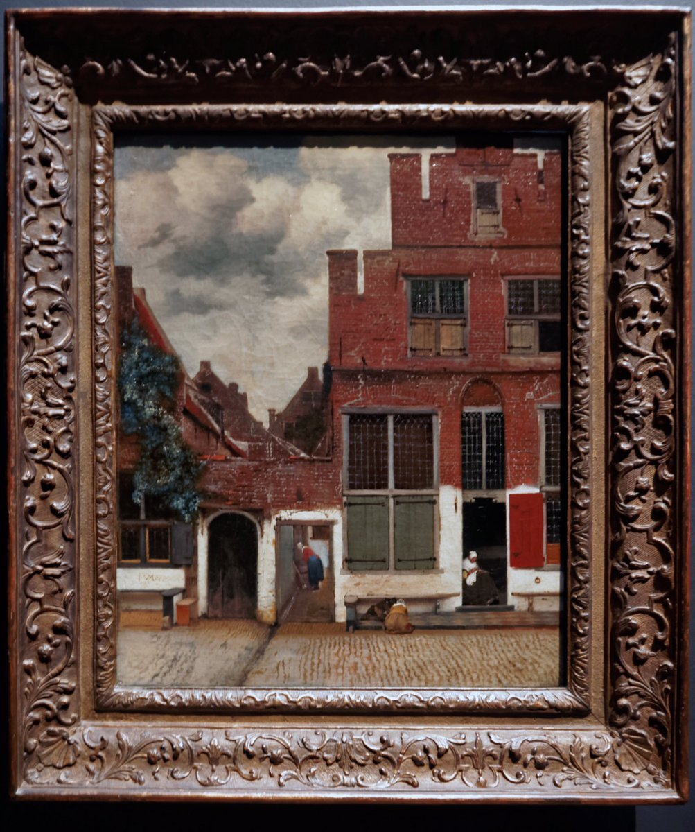 Here is Delft (c1658); exact whereabout irrelevant. Use of Camera Obscura equally tedious as a point. Vermeer painted with genius. Incidents are revealed, old bricks moulded, shutters hang awry & children play. Here is life.