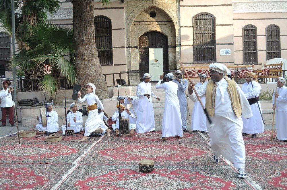 KSAForUNESCO's tweet photo. Recognized since 2016 on @UNESCO’s Intangible Cultural Heritage list, AlMezmar is a coordinated performance of drumming and dancing passed down from generation to generation in #SaudiArabia. https://t.co/Je3Uasw8l6