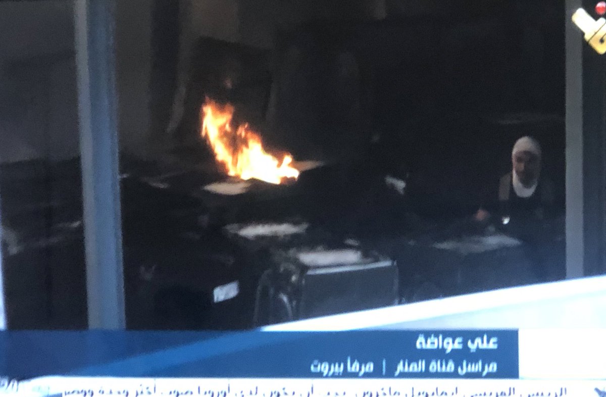 .  @Almanar_TV reporter gets closest to the blaze, reveals tires and washing machines in the hanger- repeats script several times: fire under control, army/firefighters cooperating, no injuries. Zero questions about accountability, who is responsible and how could this happen.