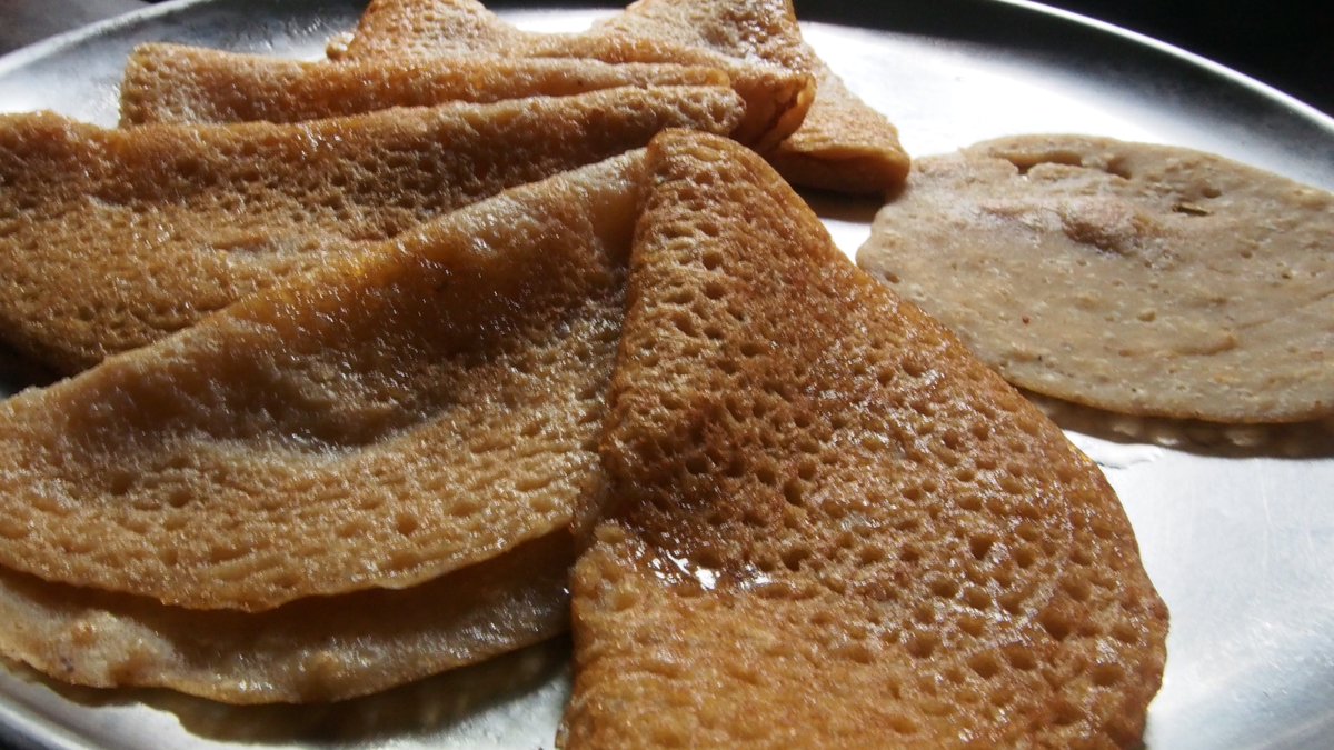 Coconut pancakes. (Rice flour + shredded coconut + jaggery + water.)Recipe courtesy  @shubs1305's mum.