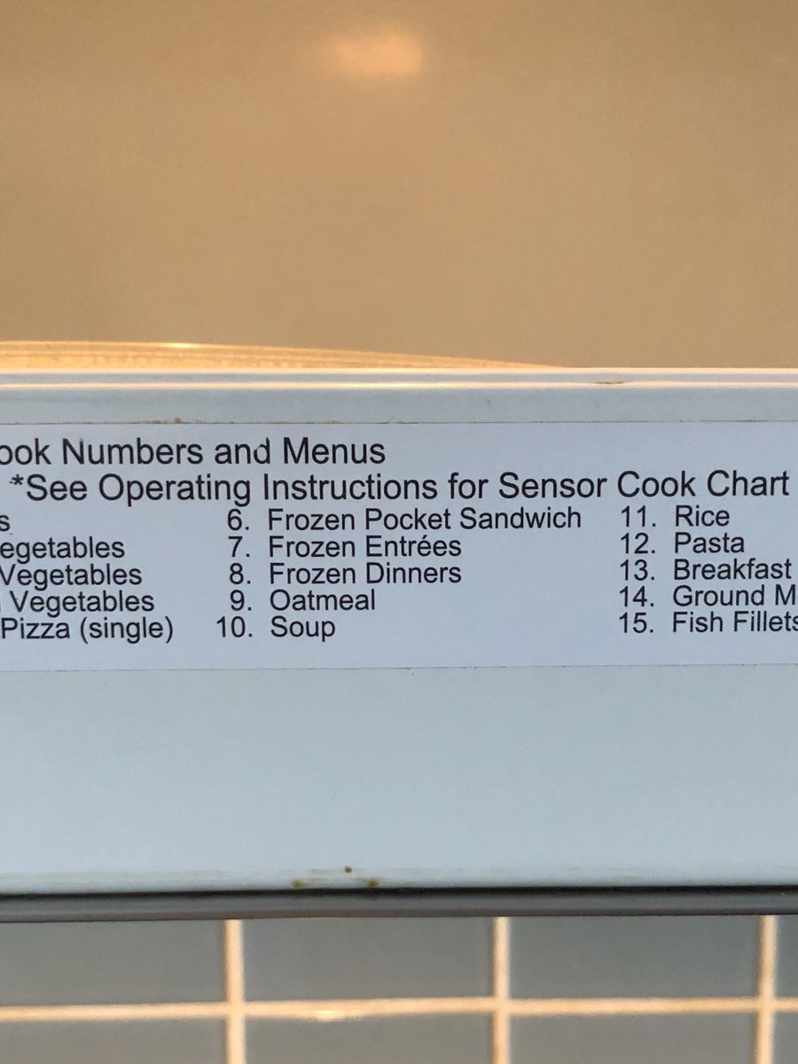beecarroll's tweet photo. The microwave in our new home has a cook chart on the inside of the door and "Frozen Pocket Sandwich" is just such a stupid and hilarious term. https://t.co/bw0Q9q35BP
