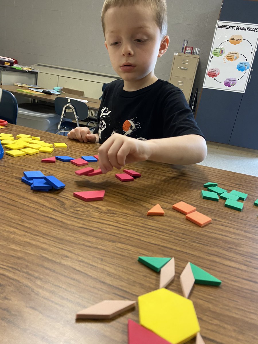 ClassWithMissW's tweet image. This #BuzzWorthy little nugget is finding ways to calm his mind! He chose to sort shapes by color!