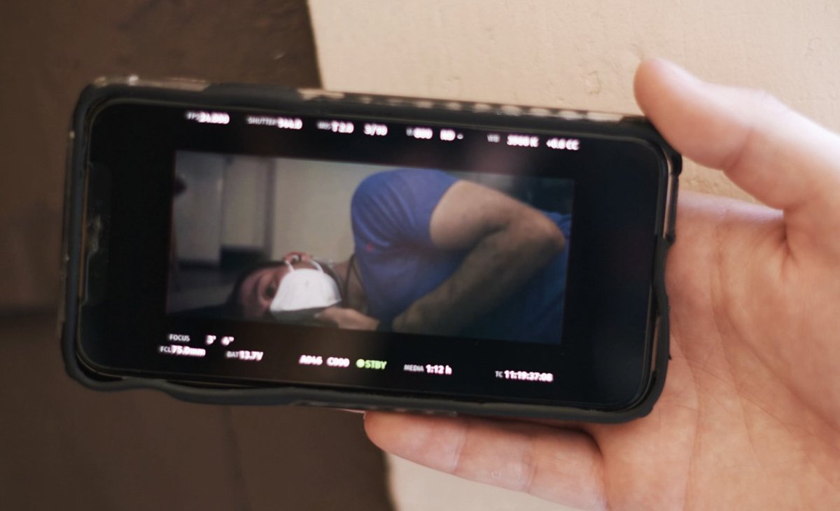 The creative process has been decentralized and digitized. Here, a producer observes a live shot of the camera beamed to his device, as opposed to huddling near the directors and producers in video village.