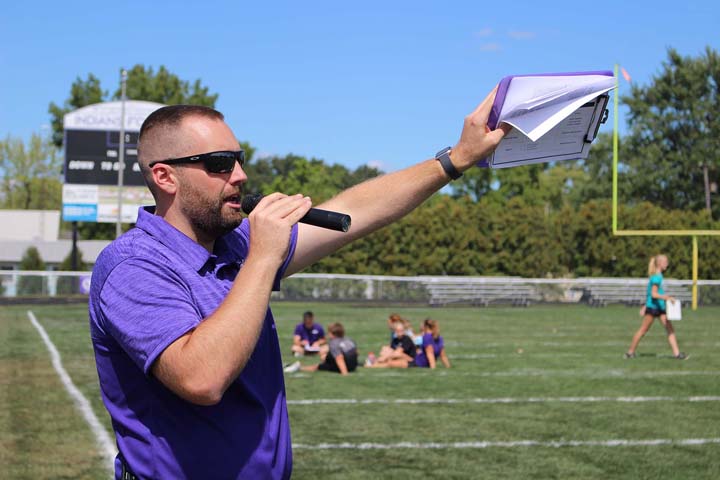 commreview's tweet photo. Ryan's rules: Fort Recovery Middle School principal Ryan Steinbrunner explains Indian Way Day trivia rules to students Friday at Barrenbrugge Athletic Park. Middle school students gathered in their respective tribes last week to participate in team building activities. https://t.co/oRTGQ0QJ2O