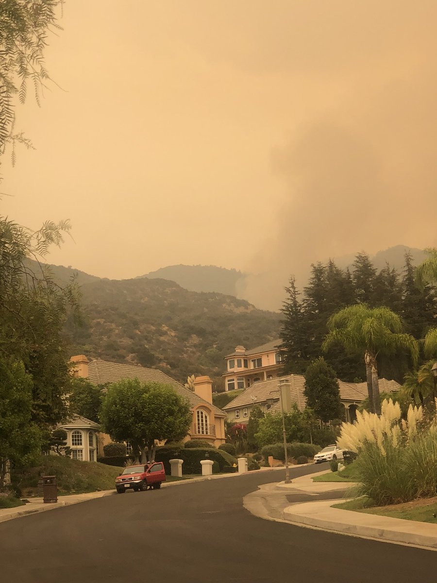 IiiNeale's tweet photo. The view from our house in Monrovia. The #BobcatFire has definitely moved southward. Spoke to a fire chief and he said it’s slow moving and up against tough terrain.  The hand crews have chipped brush, the dozers have plowed breaks and the tankers have dropped. Let us pray. https://t.co/2aHRpKXceN
