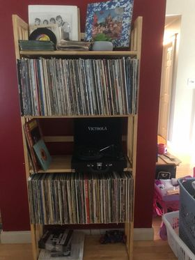 #4 inherited her dad's record collection. milk crates full of hundreds of albums, dozens of 45's. she & her hub have been going thru them. they bought a kijiji book stand& a cheap record player, picked out what they figured were the best and alphabetized them into the shelf /1