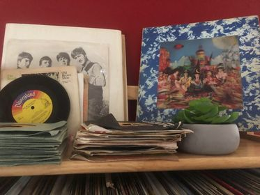 #4 inherited her dad's record collection. milk crates full of hundreds of albums, dozens of 45's. she & her hub have been going thru them. they bought a kijiji book stand& a cheap record player, picked out what they figured were the best and alphabetized them into the shelf /1