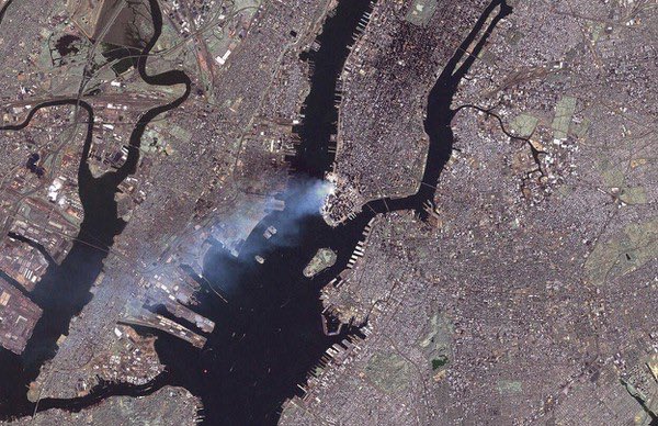 Lower Manhattan in satellite photograph taken about 9:30 AM this day 2001:                                     #USGS
