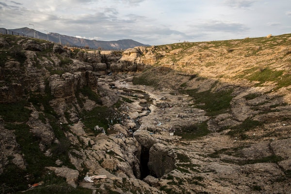 A small stream flowing into the Dudan cave in Turkey. It was here that the Armenian residents of a local village are said to have been thrown, after being led there by Ottoman gendarmes and local Kurdish paramilitary personnel.