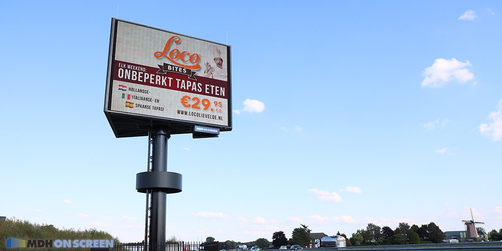 MDHOnScreen's tweet photo. Als je deze aantrekkelijke advertentie van Loco Bites uit Lievelde ziet dan loopt het water je toch in de mond? Je krijgt meteen trek in de heerlijke #tapas 😋   Deze advertentie is zichtbaar tijdens de #avondspits zodat nog effectiever de doelgroep bereikt wordt #snelwegreclame https://t.co/QtCSMzi1iS