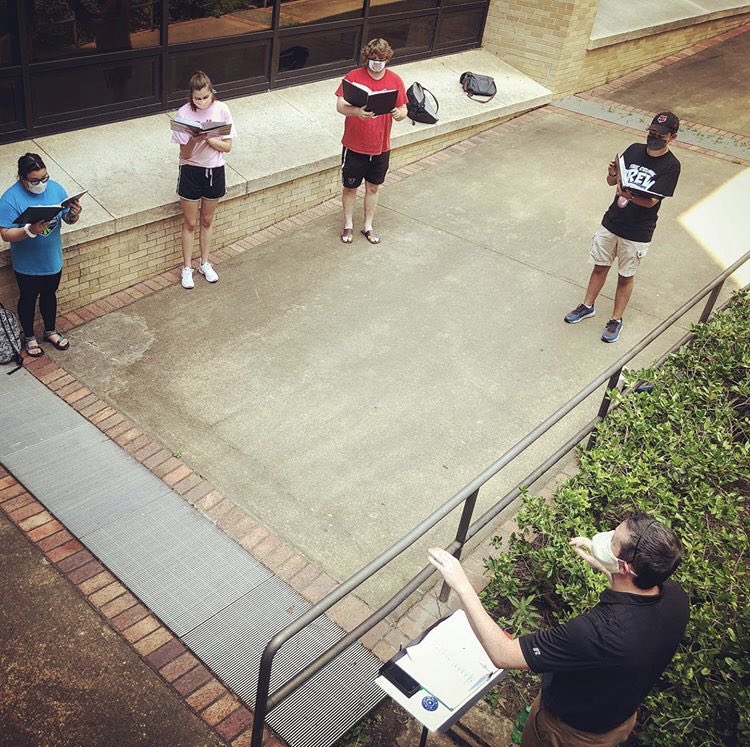 AStateChoirs's tweet photo. It’s good to be singing again! The A-State Choirs are back at it with distanced outdoor rehearsals in small groups. #Discover #AStateSings https://t.co/Pc6ezZCe4N
