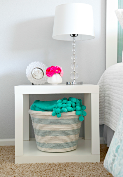 loneoaktx's tweet photo. If you've got your eye on the sweet little rope basket under this bedside table, you'll be thrilled to know that it's easy and affordable to make yourself! The base is get this a dollar-store laundry basket! Full tutorial: https://t.co/zkoqxcCbqR https://t.co/cmg8IUw1Aa