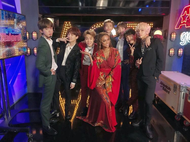 The power of Jimin in his red suit was on full display on 09/13/18 on America’s Got Talent...  @BTS_twt in Dior suits performing Idol & JK looking like “international playboy” drinking chocolate milk BH said “no performances” during the tour but...