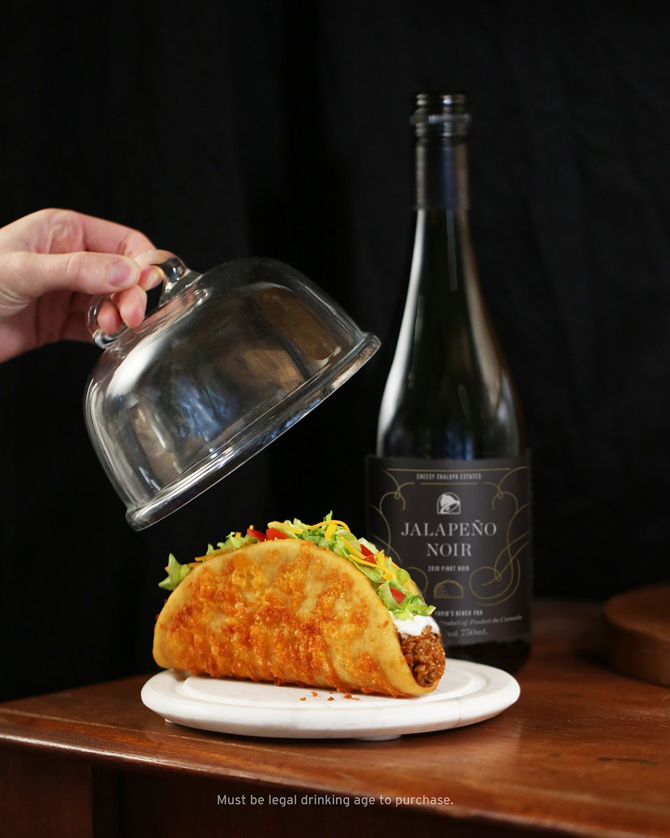 TacoBellCanada's tweet photo. Jalapeño Noir’s flavourful bouquet compliments the 6-month-aged cheddar of the Toasted Cheesy Chalupa Shell like the fates demanded it. Shop now at https://t.co/qogDEKPnL8. #WineAndToastedCheesy https://t.co/hvlQYuCnAF