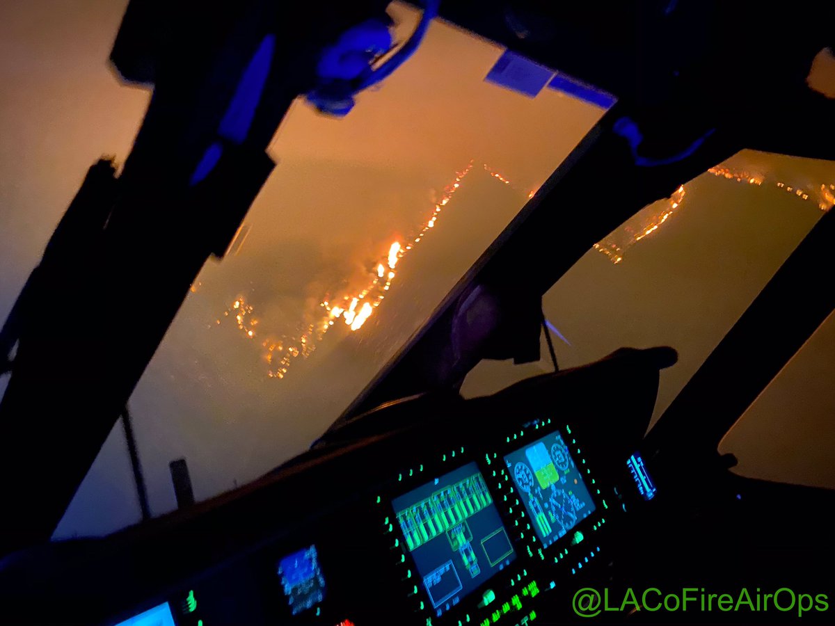 Our <a href="/LACoFireAirOps/">LACoFireAirOps</a> water dropping helicopters continue to fly missions around the clock to protect foothill communities impacted by the #BobcatFire These images were taken last night from the cockpit of a Fire Hawk helicopter, while positioning for a 1,000 gallon water drop.