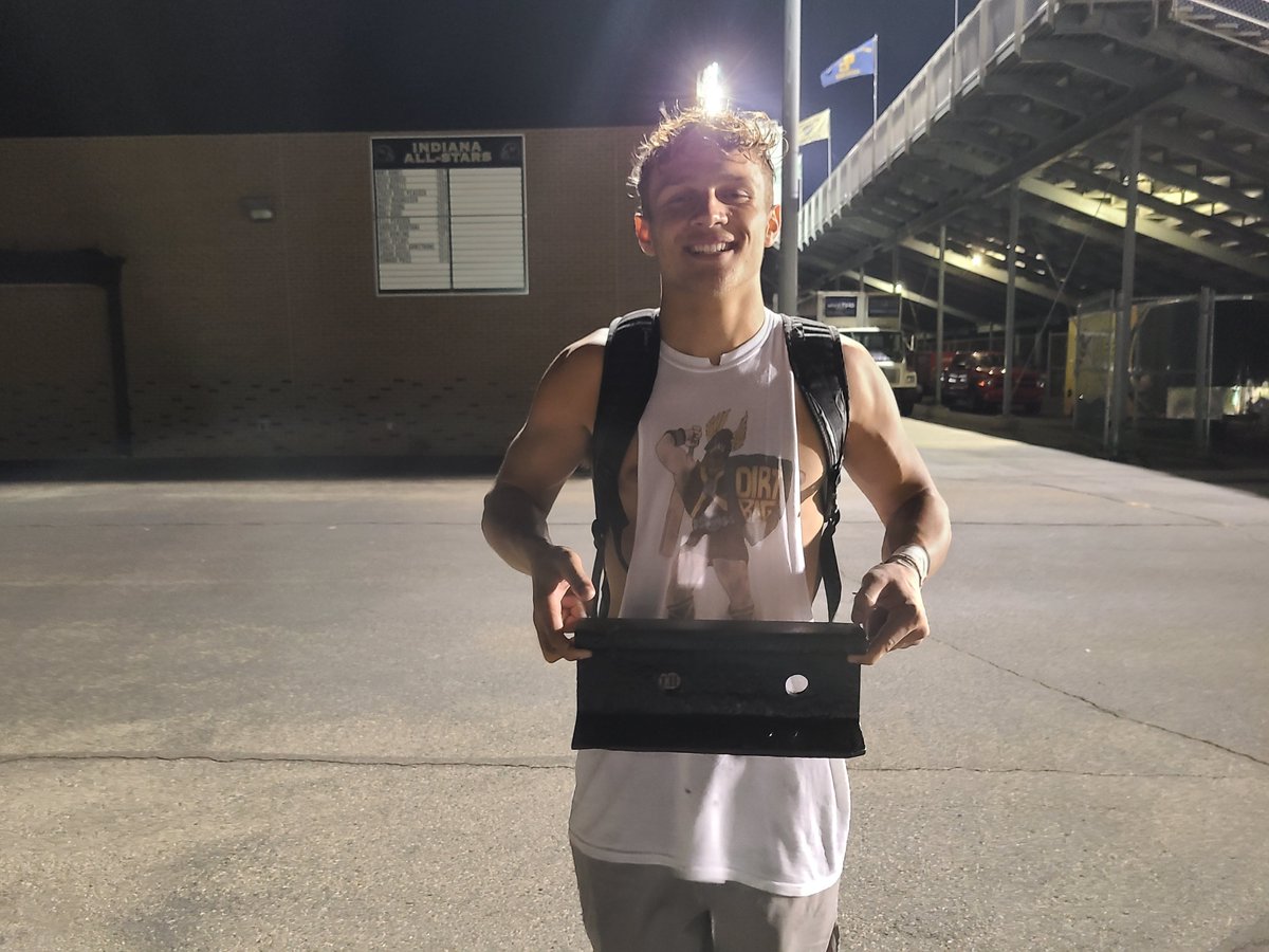 Rylan Cole with the Boundary Rail painted black ... finally. He was a ballboy for Mt. Vernon in 2012 last time it was painted black. Been New Pal red ever since. "I didn't even know what it looked like," Mt. Vernon coach Mike Kirschner said.
