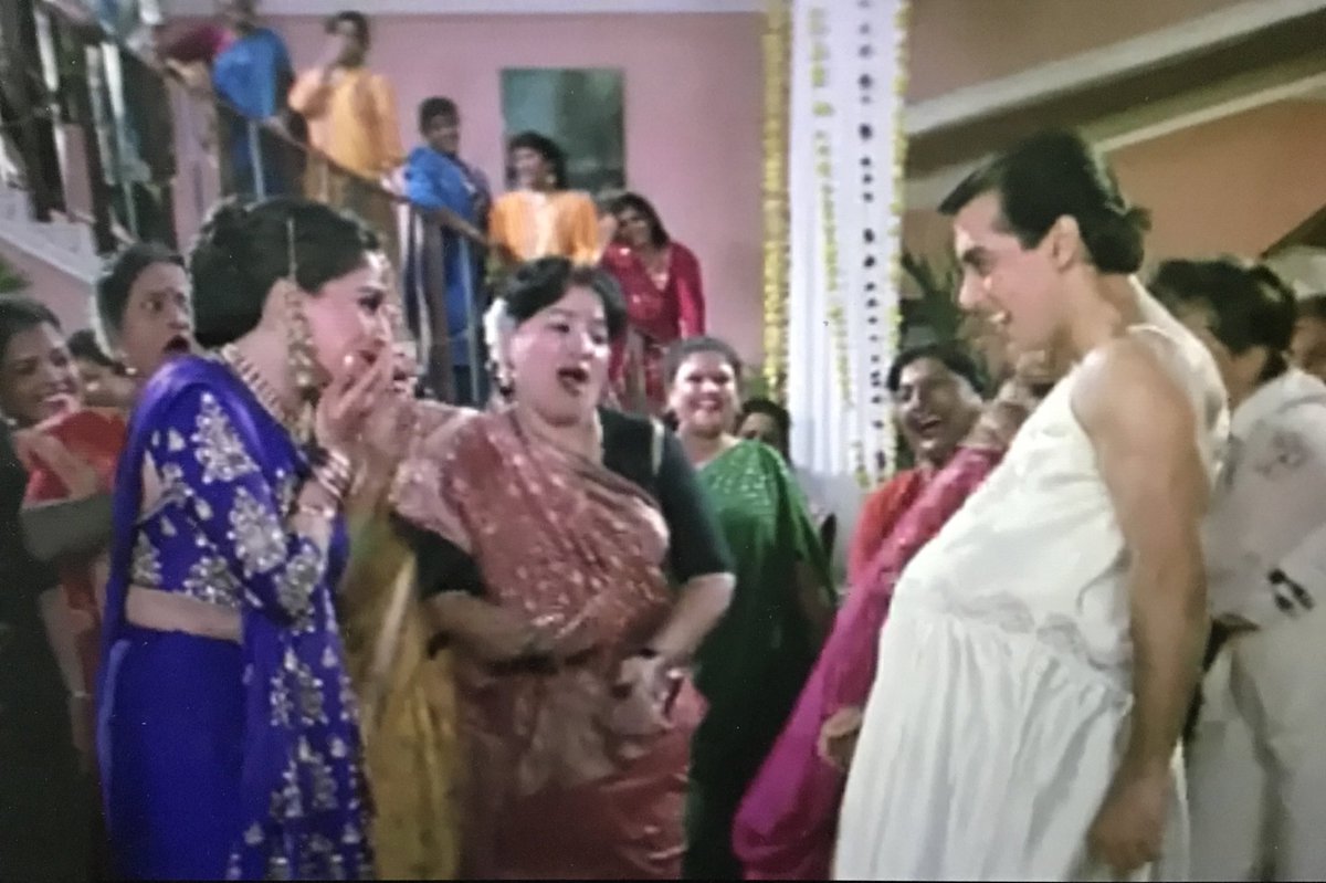 Okay now Prem dressed in a silk lingerie and pretending to be pregnant. Complete sicko this fellow is. First crash an all girls party and then do this. Everybody has forgotten Pooja at this stage even though party is in her honour because this Prem is such an attention seeker