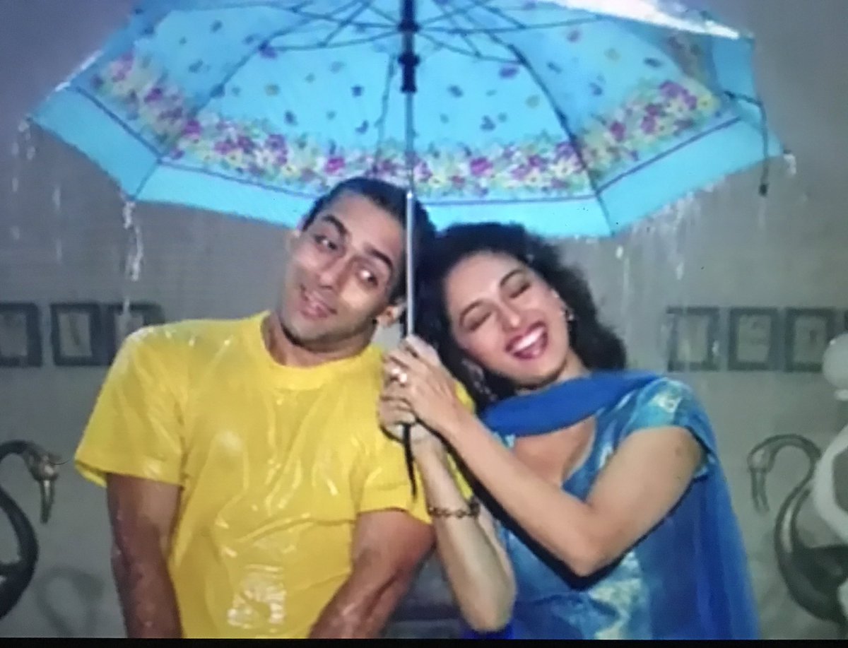 Prem as usual is an attention seeker so he goes out into the rain and does some stupid dance on one leg. Nisha runs out with an umbrella. Prem is happy. God knows what happened to the baby