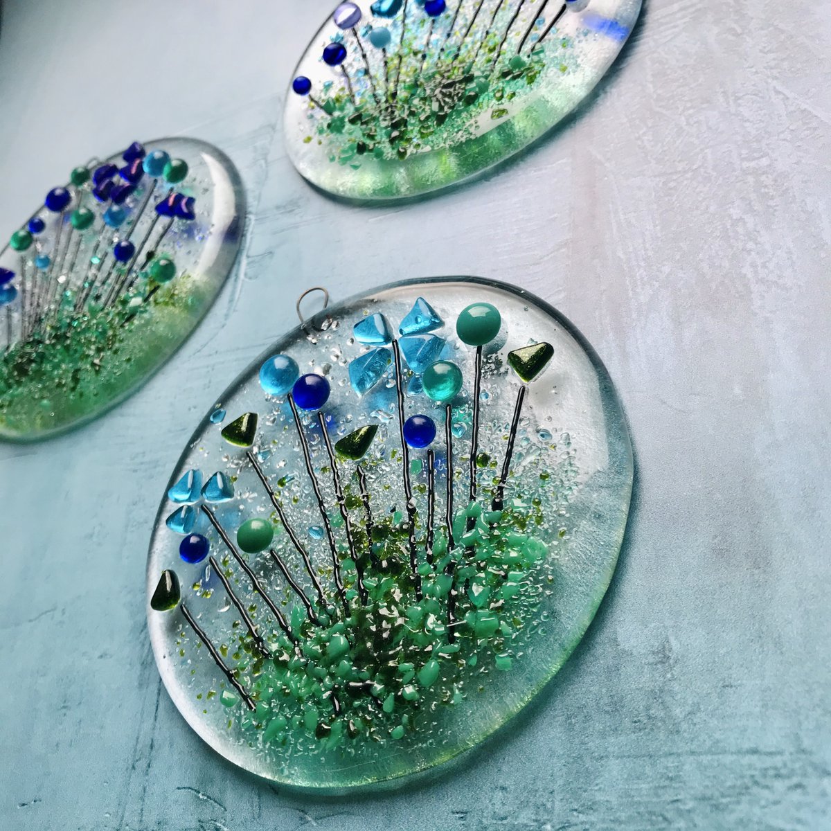 just got some new backdrop's and this is the first photo using them with a fresh batch of my suncatchers. These are really difficult to photograph but I'm very pleased with how this turned out. (I will be adding them to my tbch shop later this weekend) #fusedglass #suncatchers