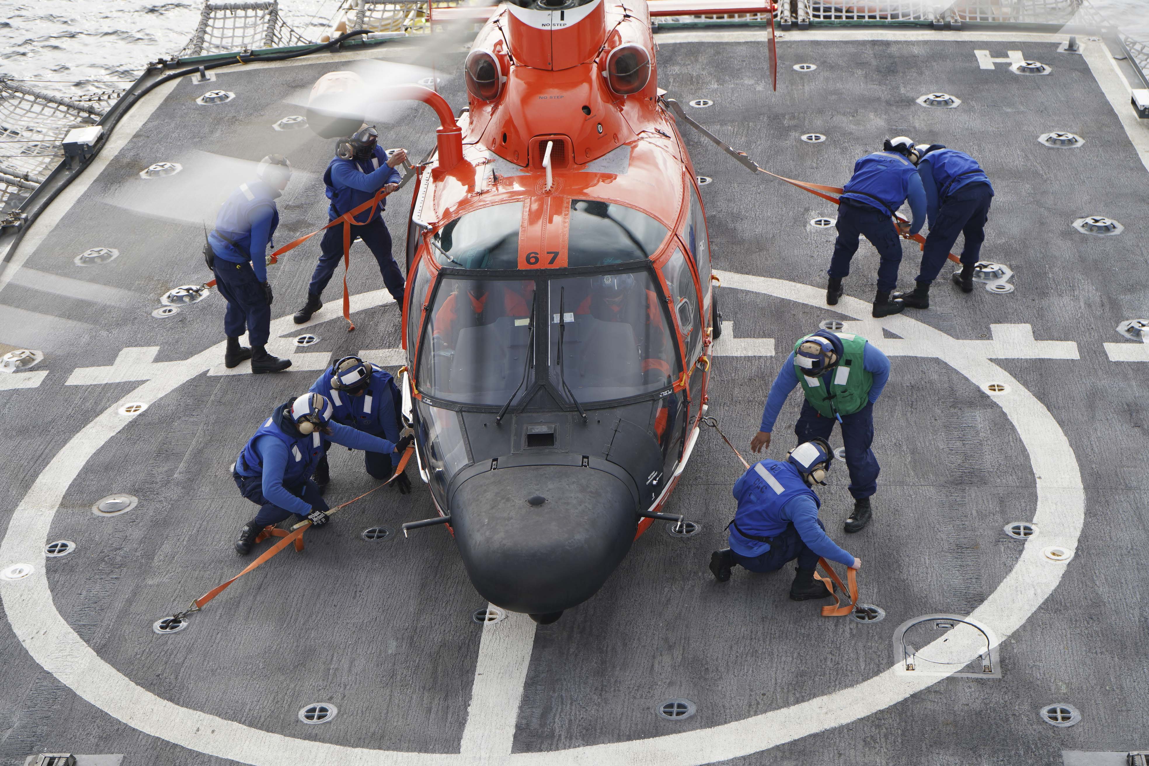 USCG Atlantic Area on X: Qualified #aircraft tie down crewmembers train  junior crewmembers the proper technique of using primary tie down straps to  secure a MH-65 #Helicopter to #USCGC CAMPBELL's flight deck. #
