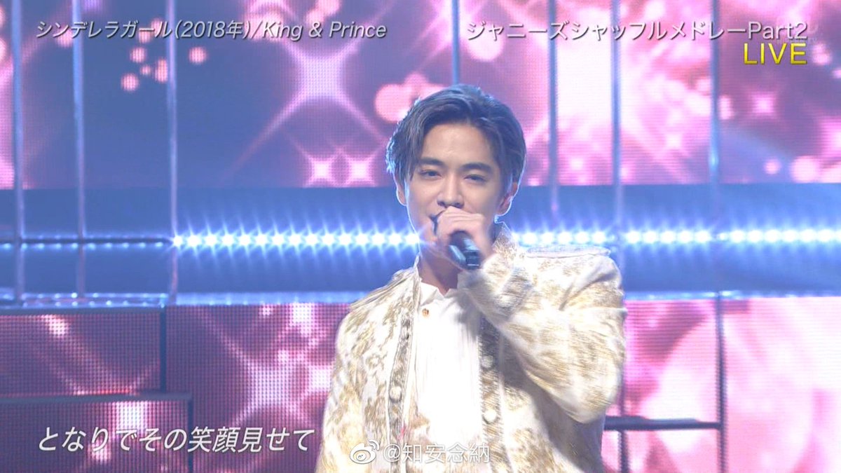 Silver haired Chinen in their white princely costume 