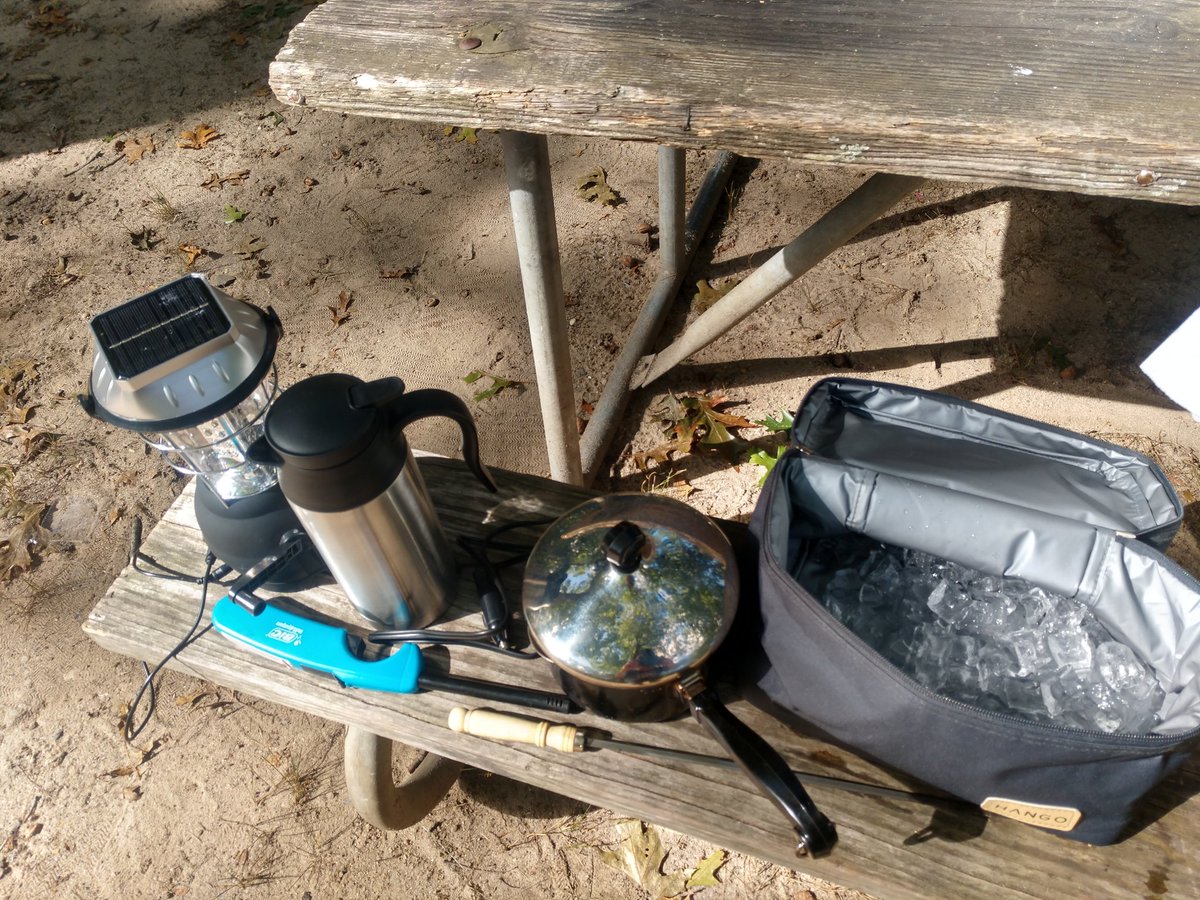 These are some of my bare essentials when outdoors. Everything cost $25 or less on amazon. A solar & crank & chargeable lantern. Steel pot with lid (lid makes it cook faster) and a groove to pour. Car kettle cos wife needs caffeine. Small ice box. Lighter. Poker/skewer.
