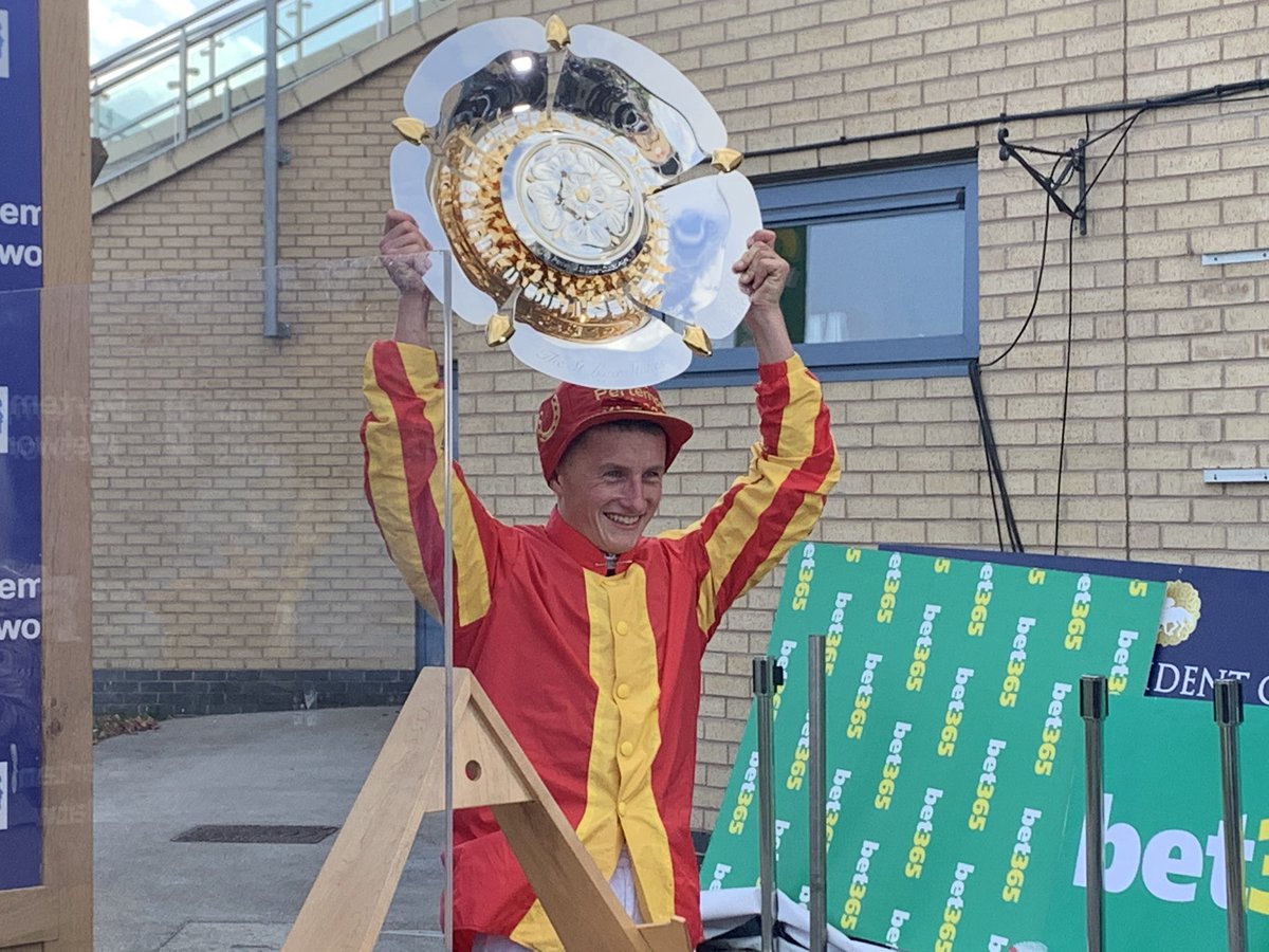 A DELIGHTED @TomMarquand holds the Pertemps St Leger shield - what a ride to win your maiden British Classic