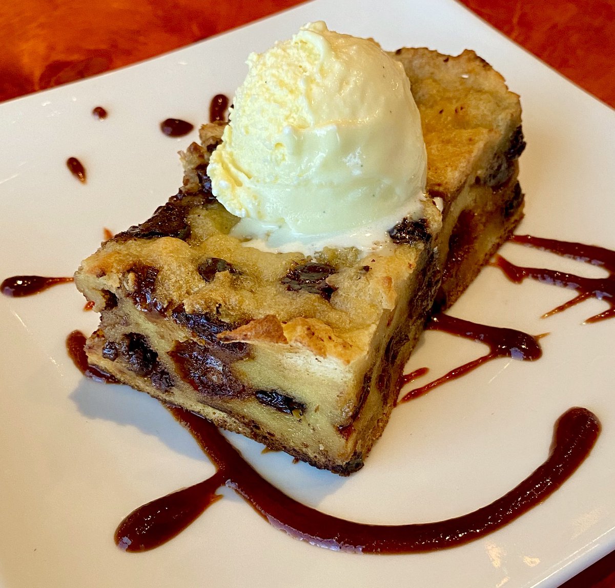 Chocolate cherry bread pudding with cherry reduction and homemade white chocolate gelato! #homemadegelato #SaturdayVibes #breadpudding #nashvilledelights #noshnash #ediblenashville #datenightdessert #musiccityeats #eatnashville #nashvillelocals #dessertwines  #andcoffee